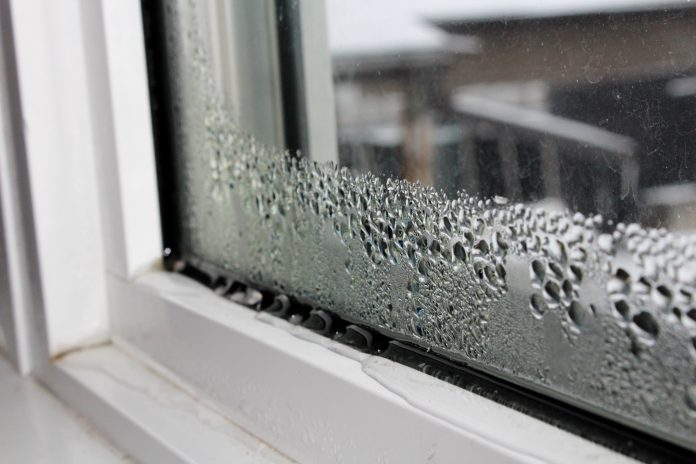 Image shows an office window full of humidity